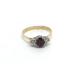 An 18carat gold ring set with an almandine garnet