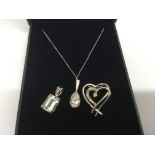 A 9 ct gold pendant and chain and two 9 ct white g