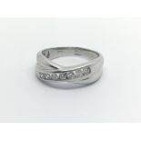 An 18carat white gold ring set with a row of brilliant cut diamonds Approximately 0.33 of a carat