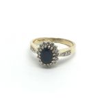 An 18carat gold ring set with a blue sapphire flan