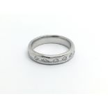 An 18carat white gold modern design ring set with five diamonds ring sizeL