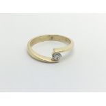 An 18carat gold ring set with a brilliant cut soli