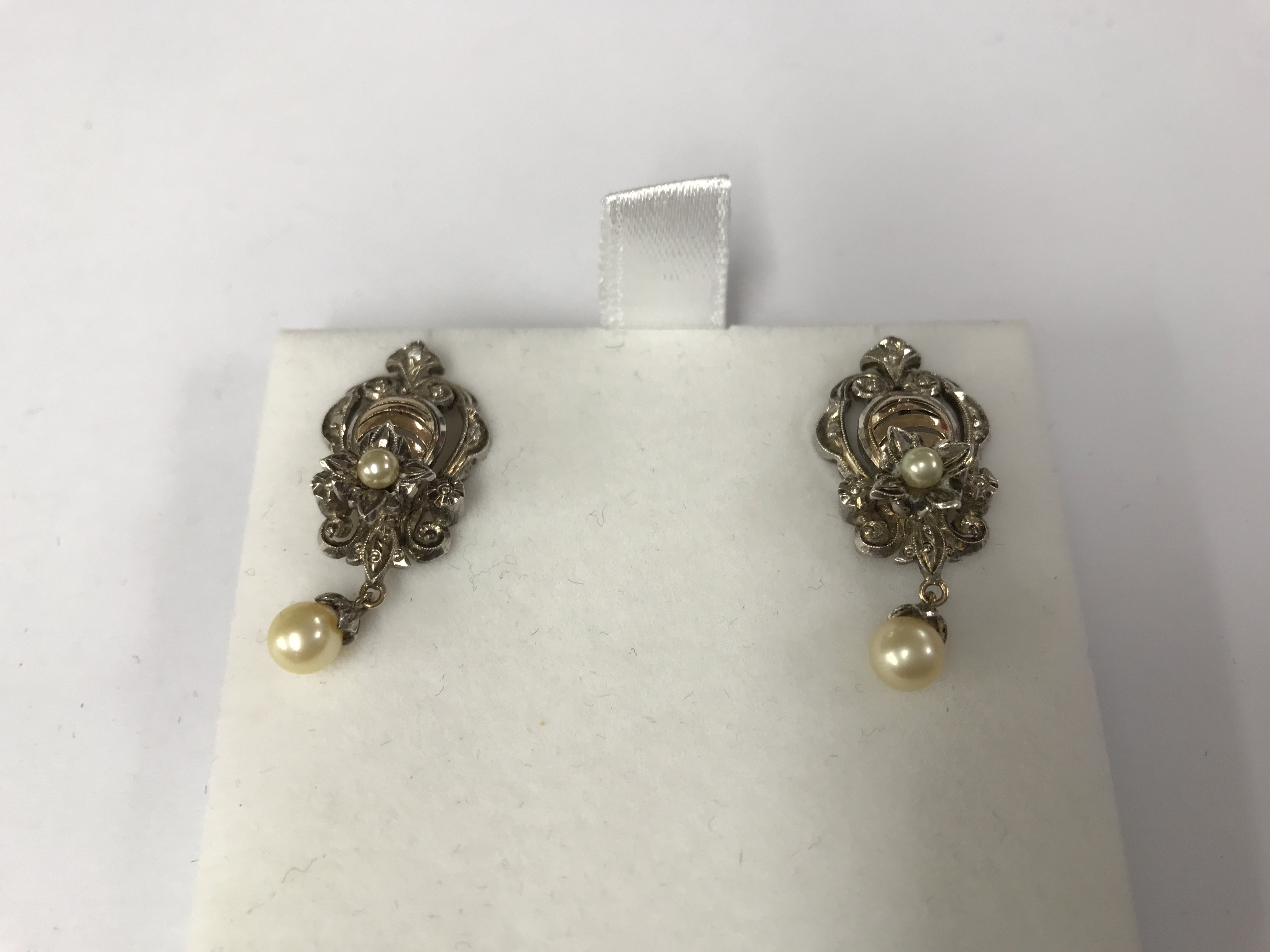 A pair of 9ct gold and seed pearl earrings