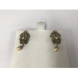A pair of 9ct gold and seed pearl earrings