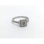An 18carat white gold ring set with a square pattern of diamonds with diamonds set in the shark ring