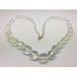 A restrung crystal necklace with 9ct gold clasps.