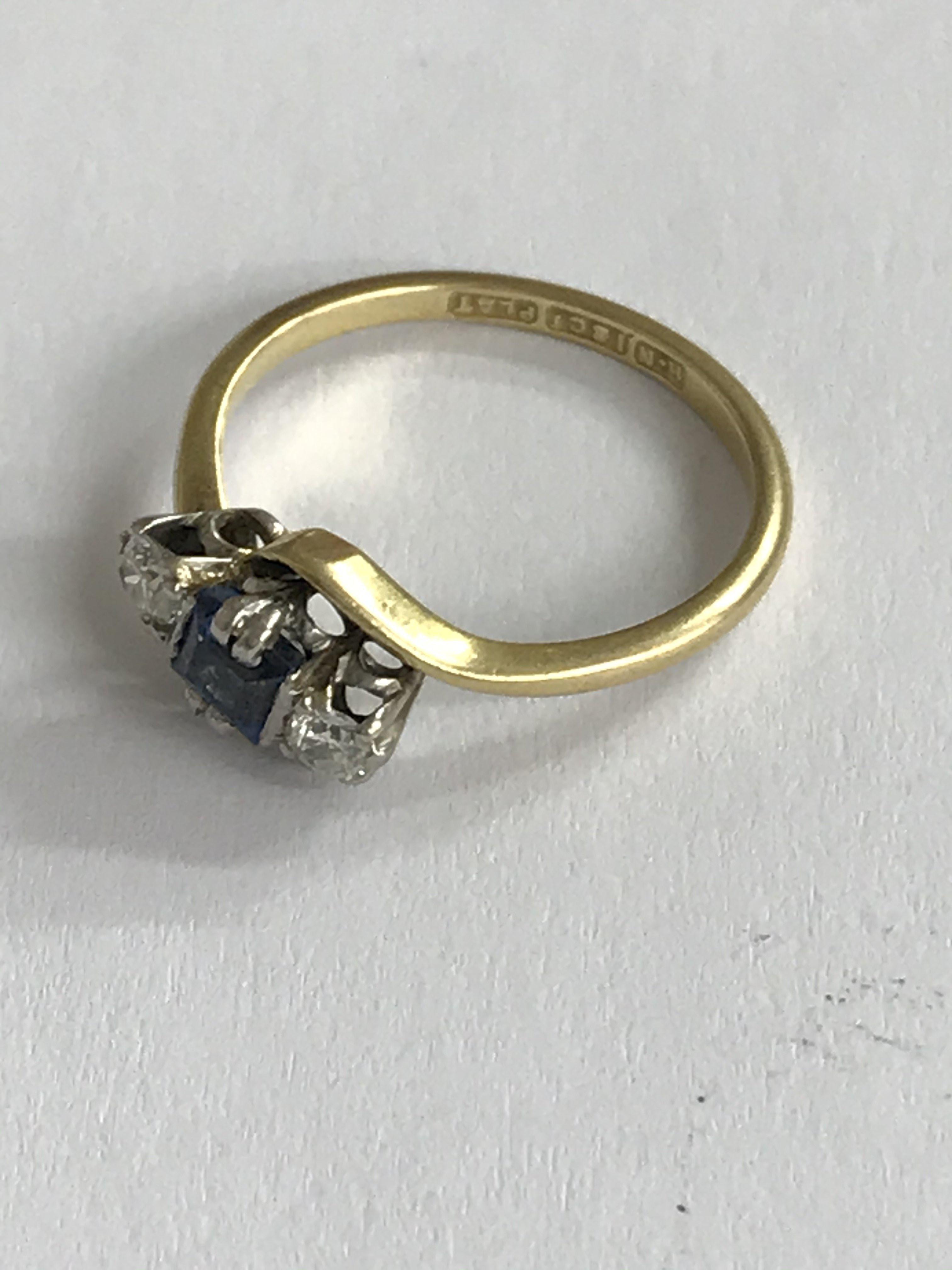 An 18ct gold and platinum square cut sapphire and