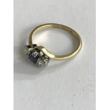 An 18ct gold and platinum square cut sapphire and