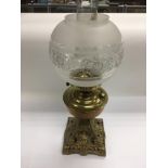 A brass oil lamp.