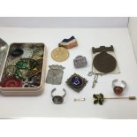 A tin of jewellery items including some silver, go