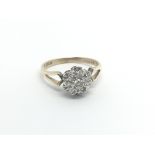 A 9carat gold ring set with a cluster of diamonds
