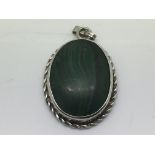 A silver and malachite pendant.