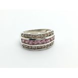 A silver ring set with pink and white CZ stones ri