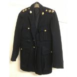 A military style coat with Church Lads Brigade buttons bearing the slogan 'Fight The Good Fight'.