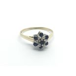 9carat gold ring set with a pattern of sapphire and diamonds ring size O-P.