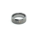 A Titanium wedding band set with a solitaire diamo