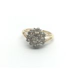 An 18carat gold ring set with a cluster of diamond