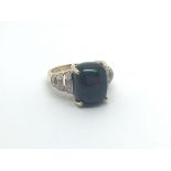 A 9carat gold ring set with a blood stone the shank with vertical rows of brilliant cut diamonds