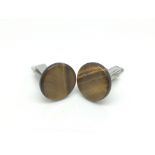 A pair of sterling silver and tiger's eye quartz c