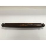 A 19th Century amboyna desk roller, approx length 40cm.