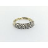 An 18carat gold ring half hoop eternity ring set w