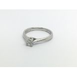 An 18carat white gold ring set with a solitaire di