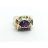 An unusual ring set with multi coloured stones and