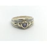 A 9carat gold ring set with a heart shaped Tanzani