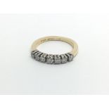 An 18carat gold ring set with a row of brilliant cut diamonds approximately 0.50 of a carat ring