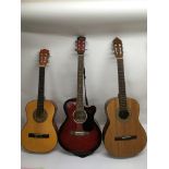 A Swift archtop acoustic guitar plus two classical