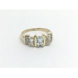 A 10carat gold ring set with aquamarine stones and