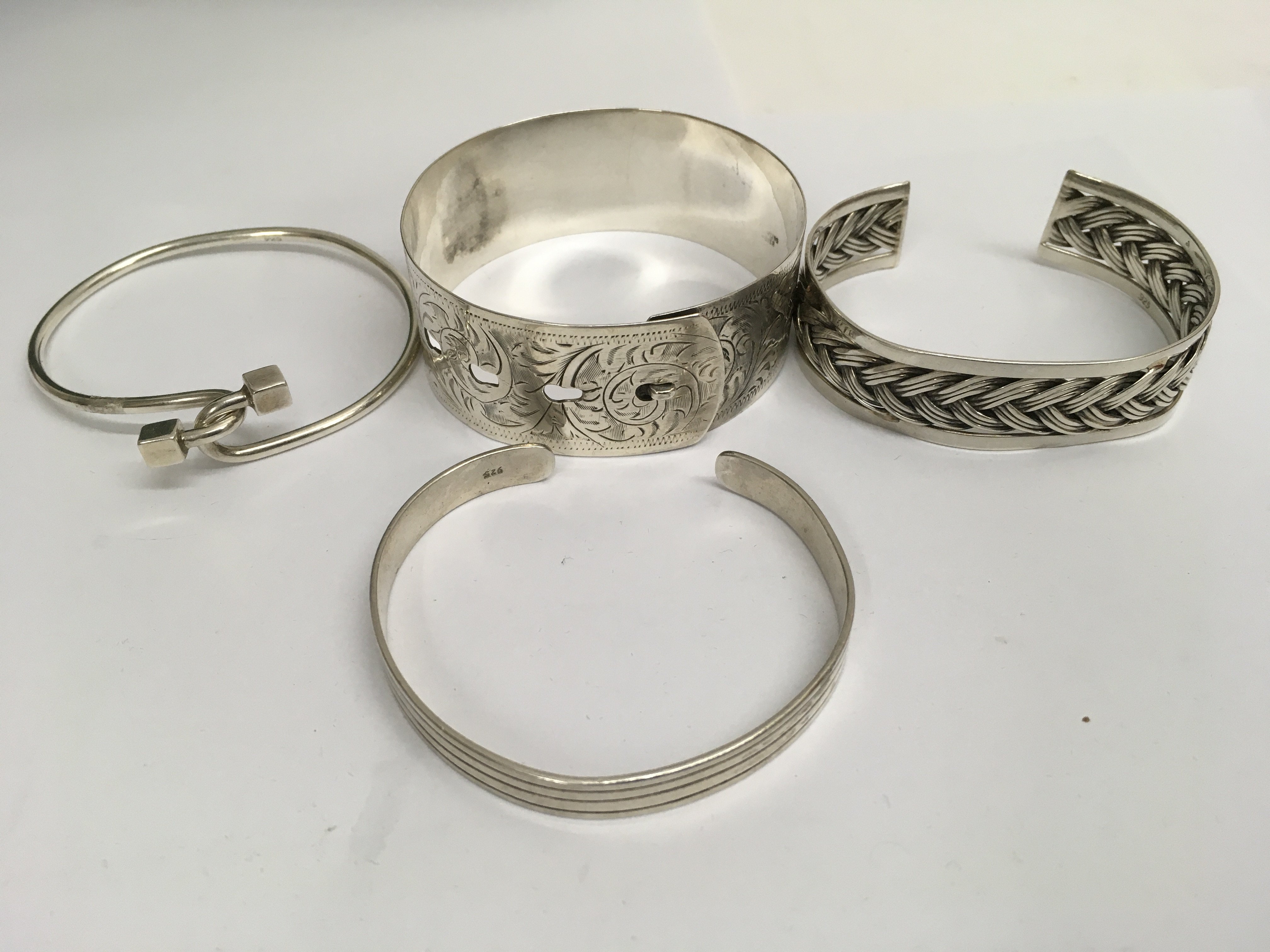 A collection of four 925 Sterling bangles