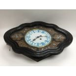 A Victorian oval shaped wall clock with mother of
