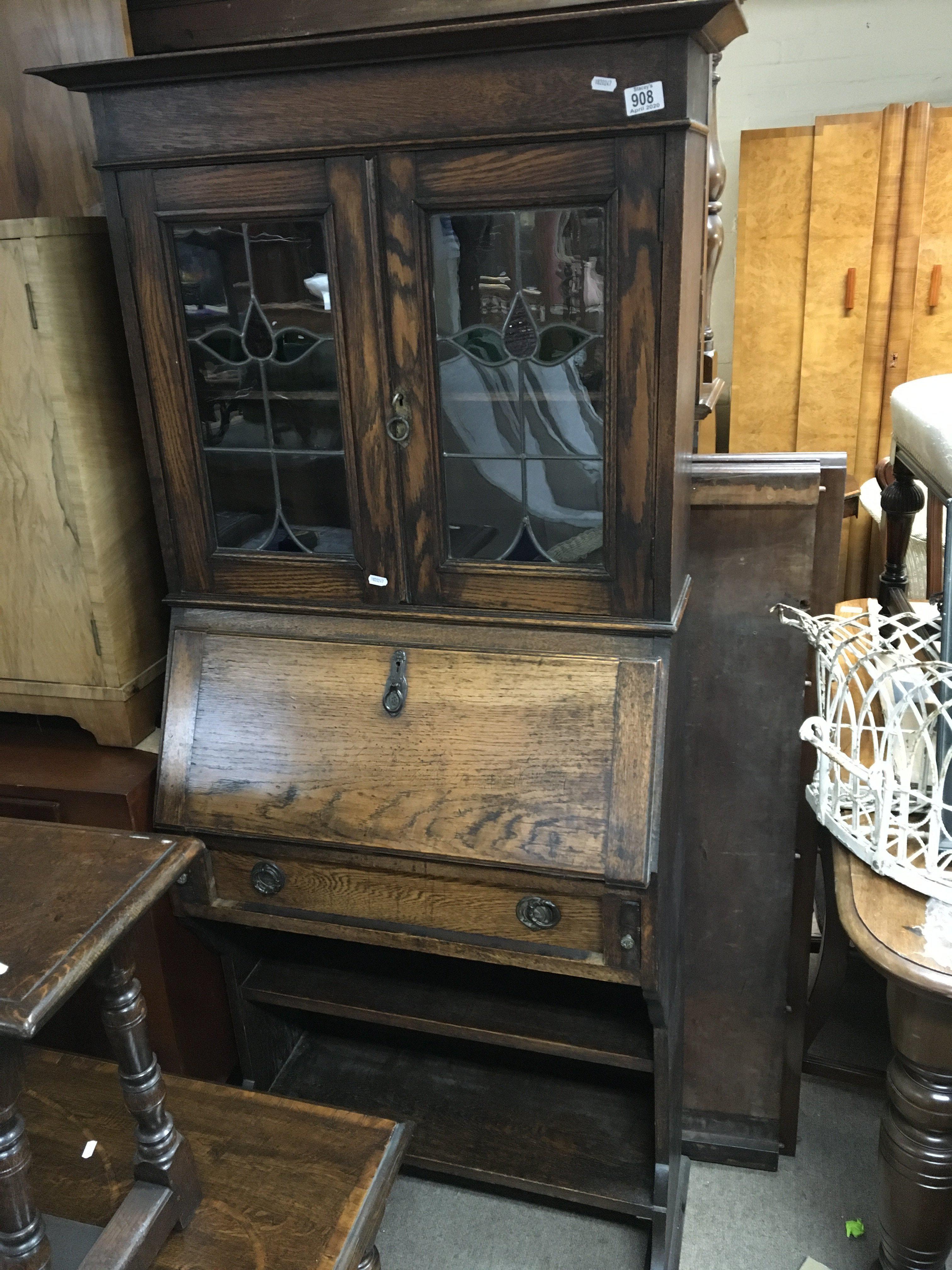 A small arts and crafts oak bureau bookcase with leaded glass doors. 172cm x 71cm