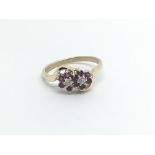 A 9carat gold ring set with a pattern of ruby and