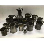 A collection of pewter tankards.