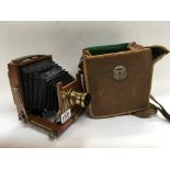 A cased mahogany quarter plate camera.