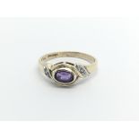 A 9carat gold ring set with an amethyst and small diamonds ring size K.