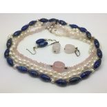 Three necklaces comprising a lapis lazuli example,