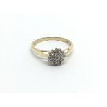 A 9carat gold ring set with a pattern of diamonds