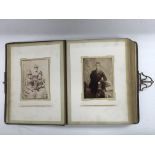 A Victorian leather bound photo album.