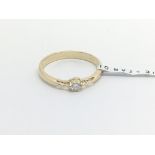 A 9carat gold ring set with a solitaire brilliant