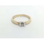 An 18carat gold ring set with a solitaire diamond