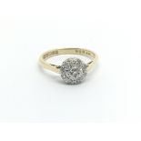 An 18carat gold ring set with a circular pattern o