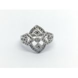 An Art Deco style ring of open geometric design set with diamonds ring size M-N