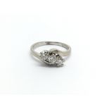 An 18carat white gold ring set with three brillian