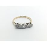 A 1930s Vintage 18carat gold ring set with five diamonds. ring size O.