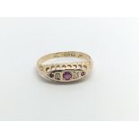 An 18carat gold ring set with ruby and diamonds ring size I.