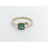 An 18carat gold ring set a Square Emerald the shan