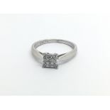 An 18carat white gold ring set with a square pattern of diamonds ring size K-L
